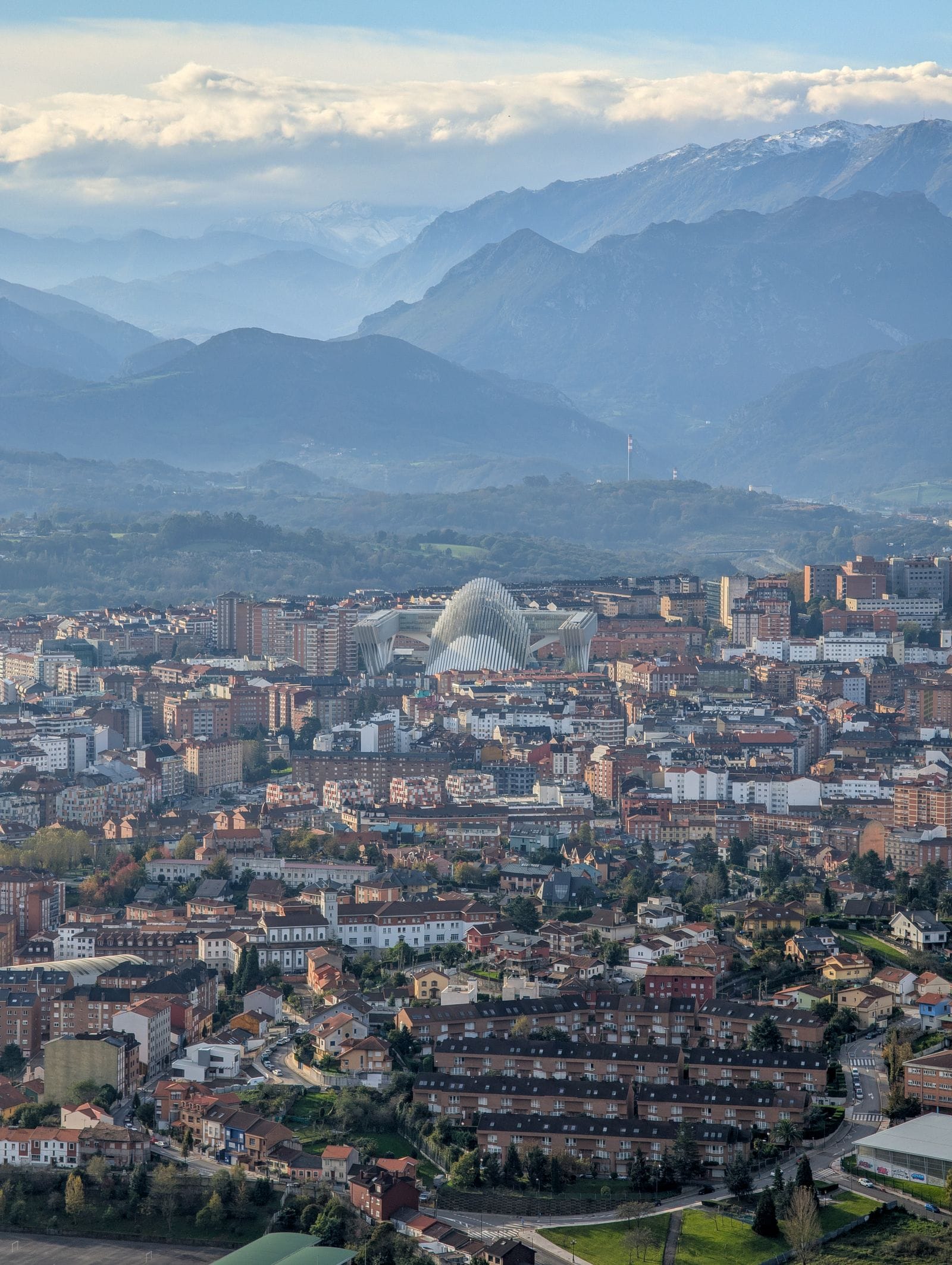 Aerial view of Oviedo with snowy mountains